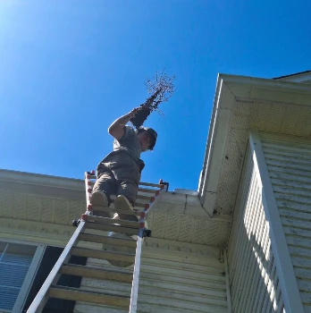 Before and after professional gutter cleaning in Mocksville NC