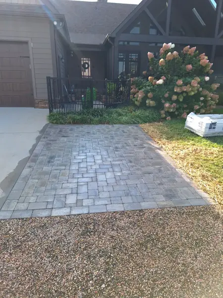 Custom stone walkway nearing completion - Olmedo Home Services craftsmanship Mocksville NC