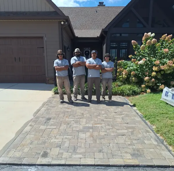 Daniel, Isaiah and Ryan Olmedo standing proudly over completed custom stone walkway project in Mocksville NC